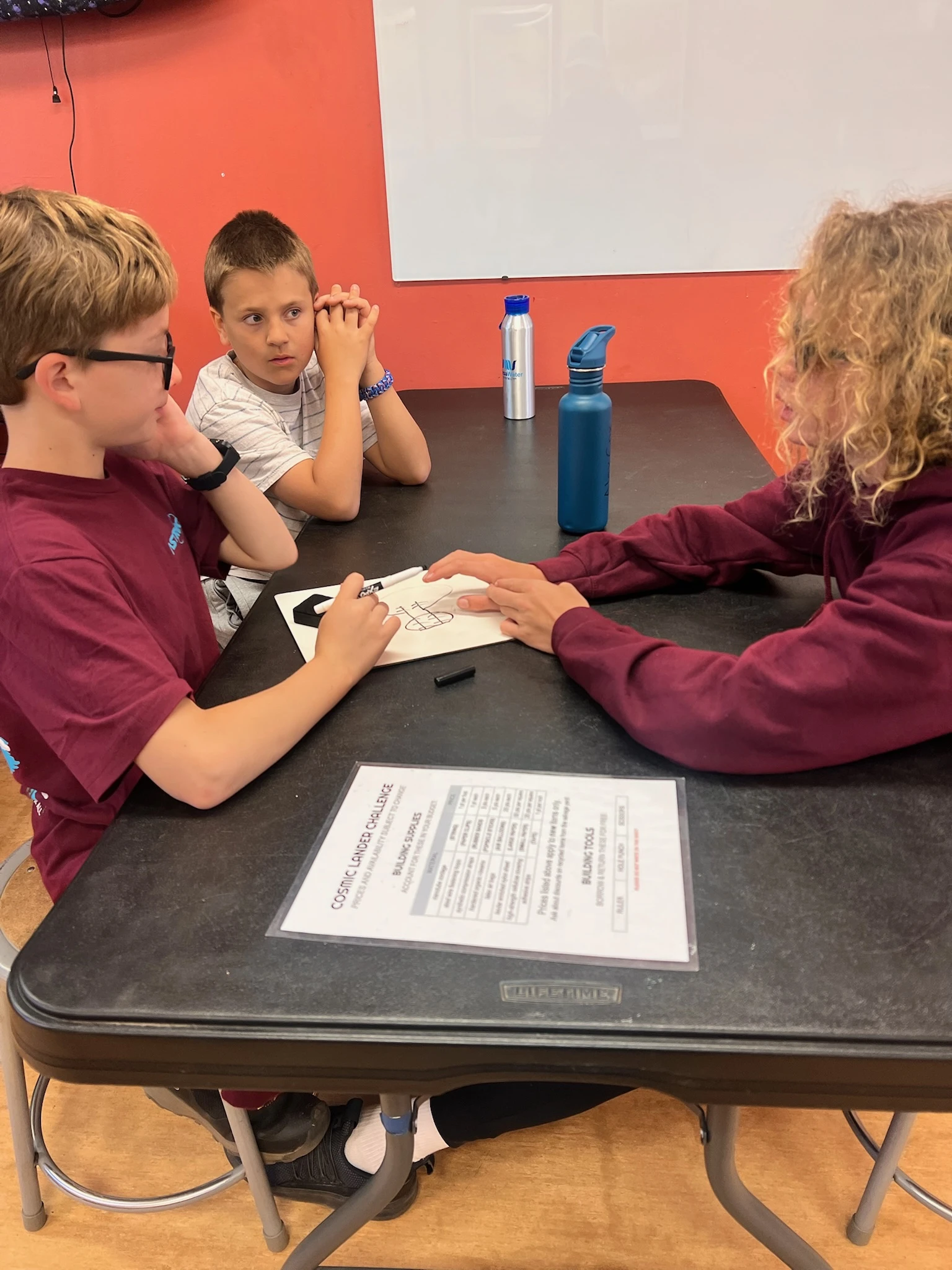 Page Academy students working through a science challenge together at AstroCamp