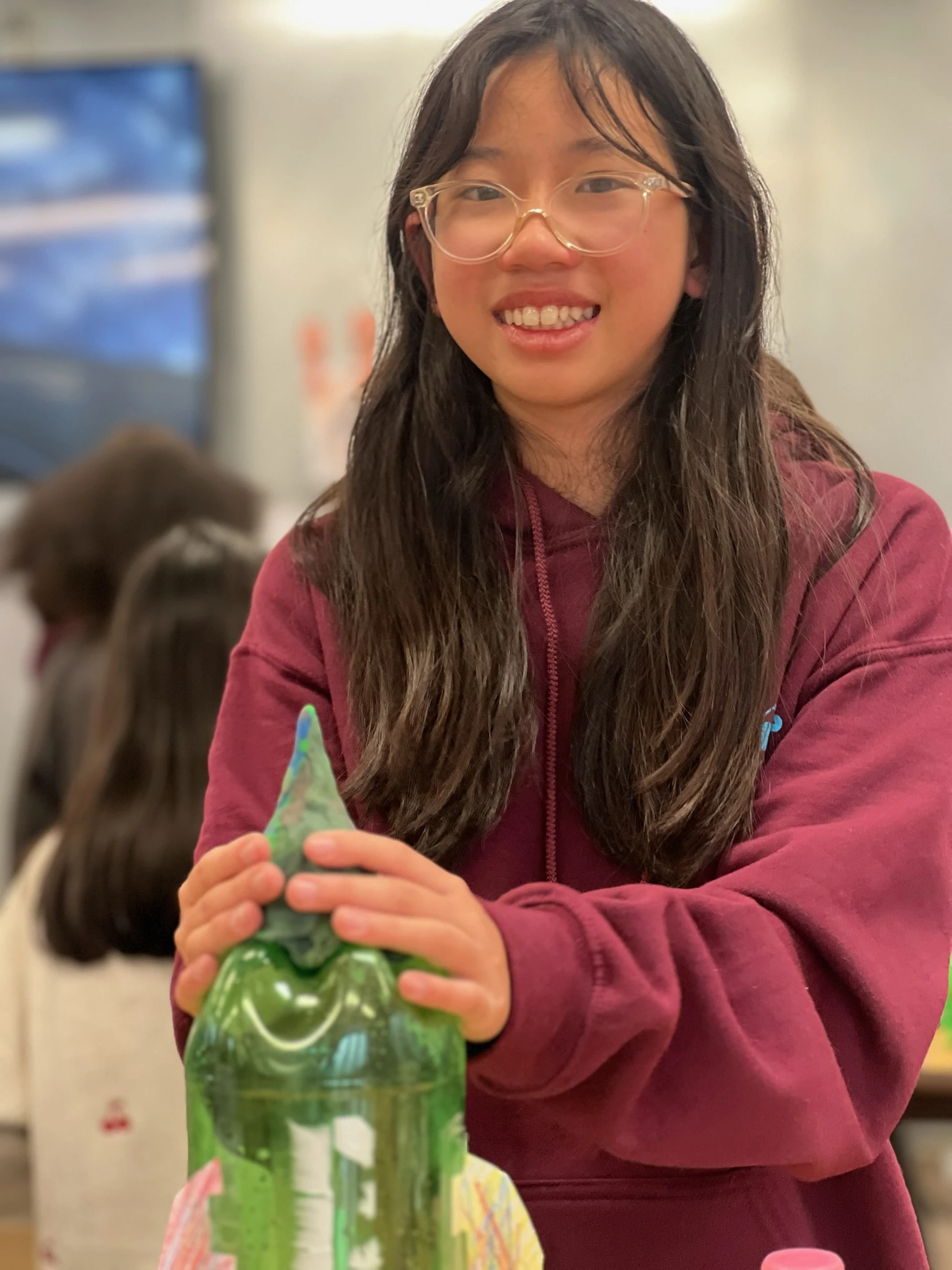 Page Academy student holding a project she built