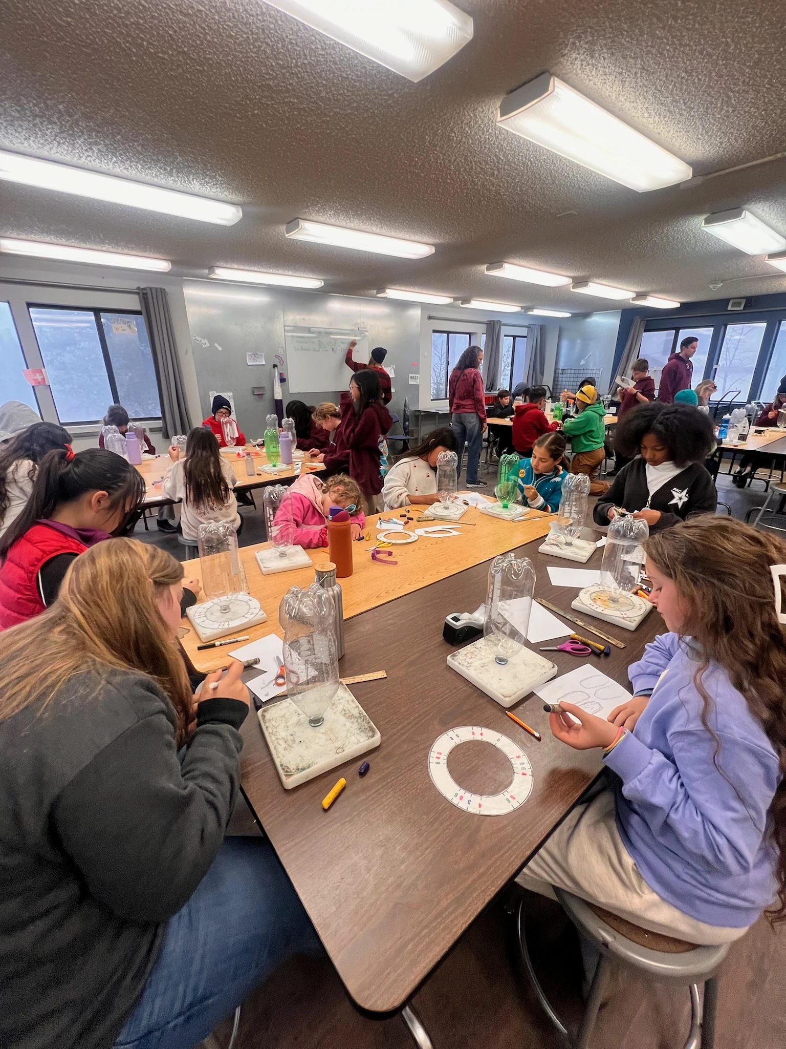 Page Academy students building and testing projects at their work tables