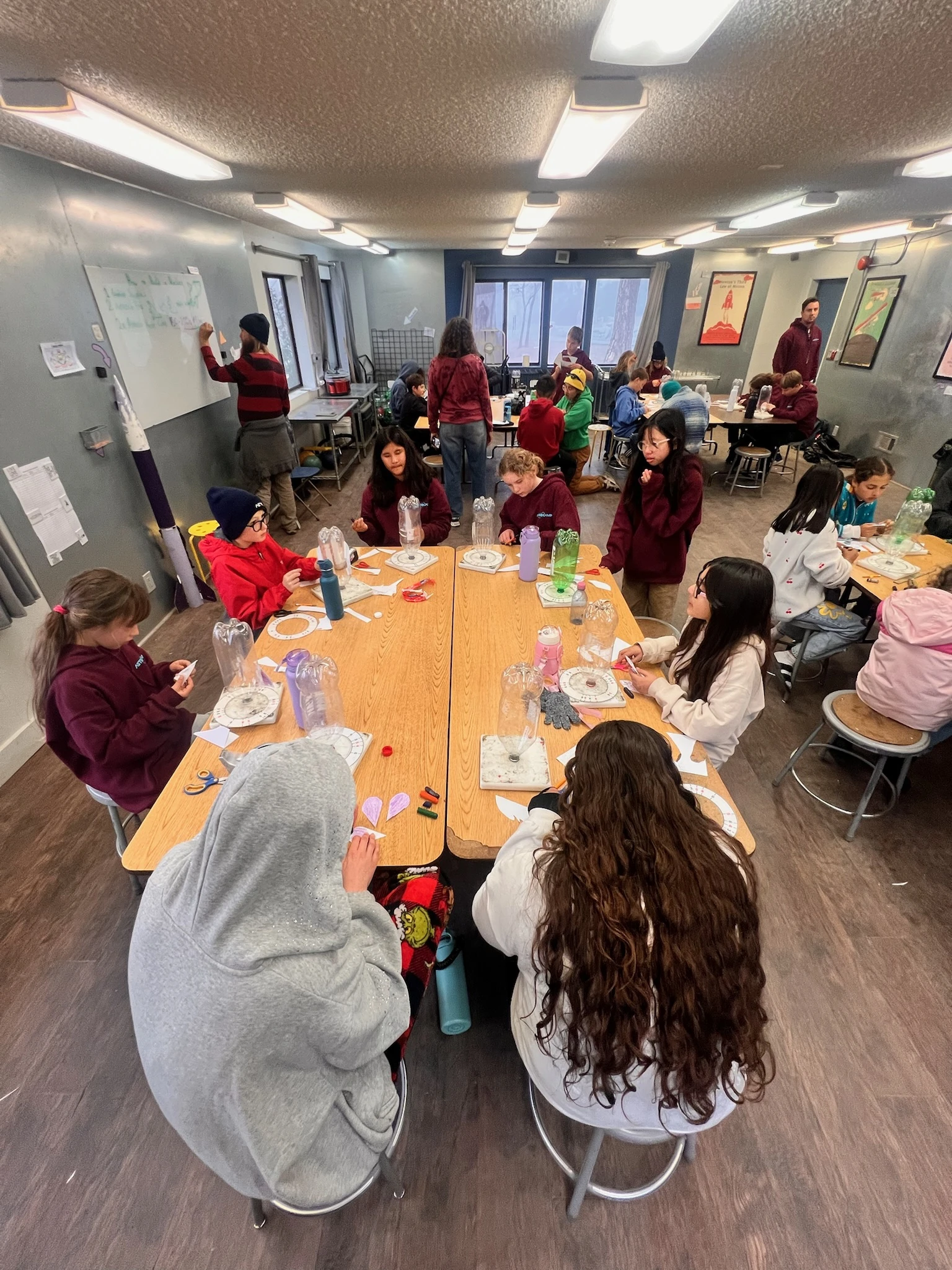 Page Academy students working together at long tables during a hands-on lesson