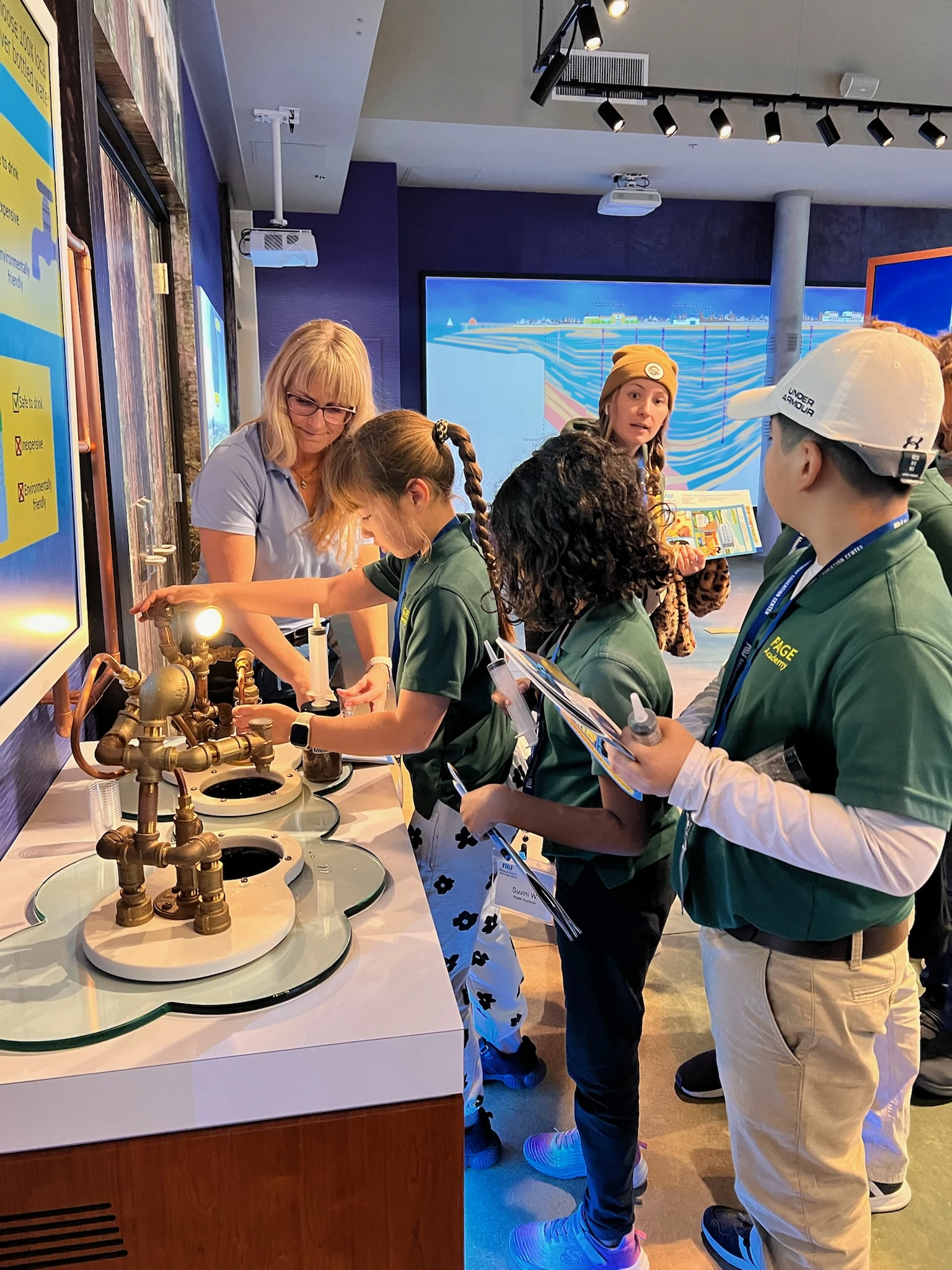 Page Academy elementary students exploring a hands-on science exhibit