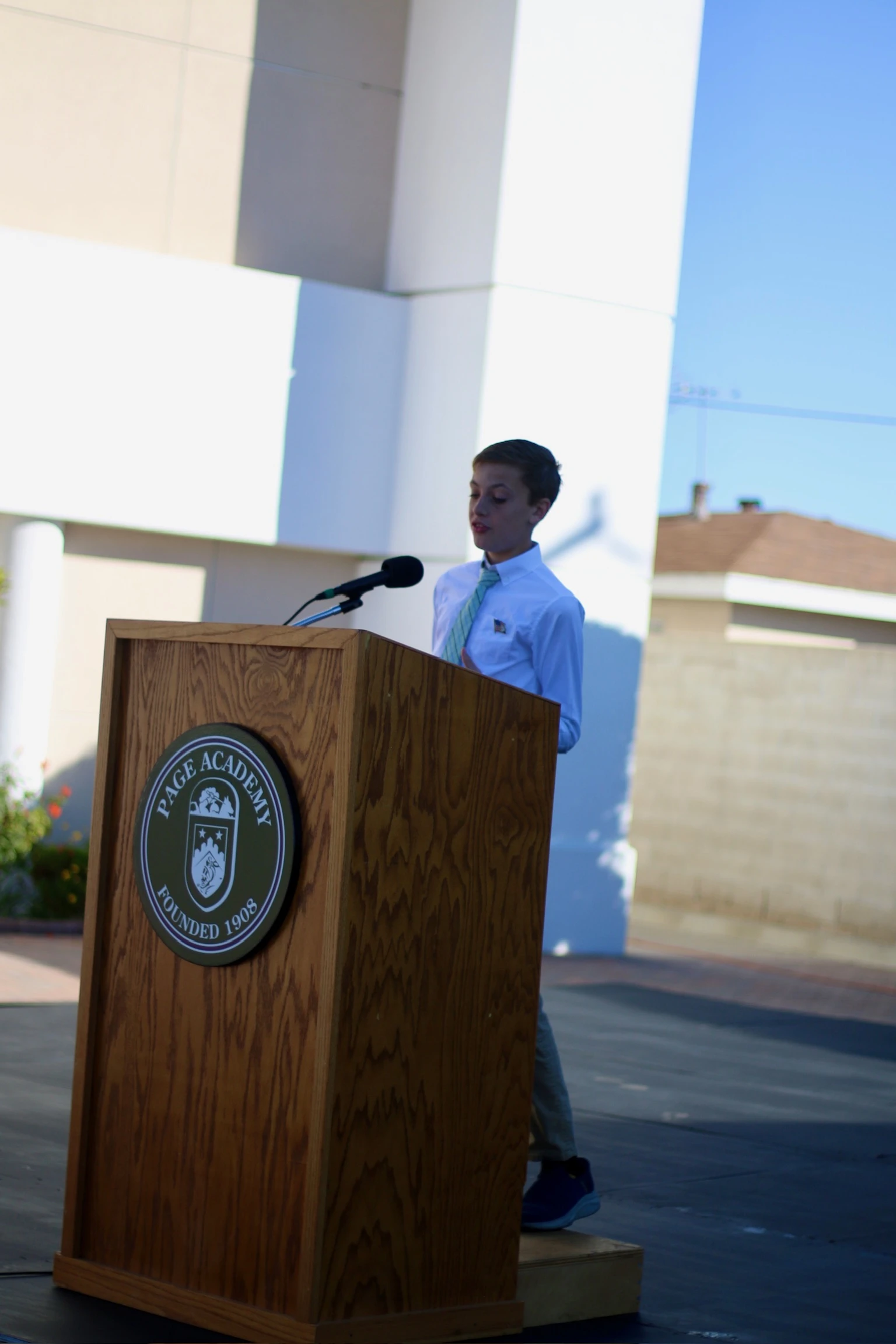 Page Academy student speaking at the school podium